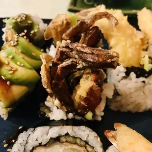 a plate of sushi rolls