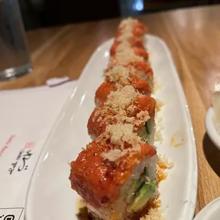 a plate of sushi and a bowl of ice cream