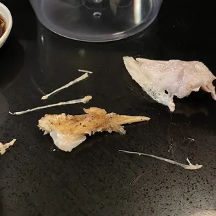 Bones and a fin from fried salmon