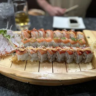 Left is salmon belly sashimi. Top is sunshine roll, middle is new Philadelphia roll and bottom is the strawberry fields roll.