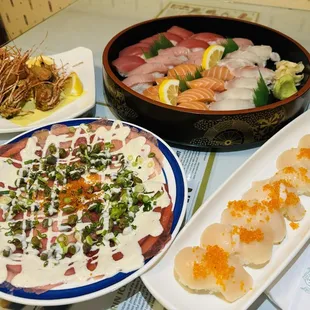 Tuna carpaccio, fresh scallops, assorted nigiri's. Yum