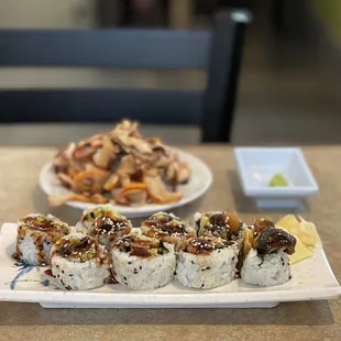 two plates of sushi on a table