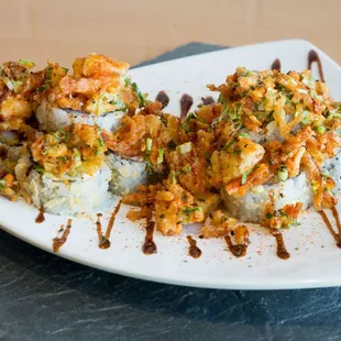 Admiral Crunch Roll - Deep Fried Roll filled with Tempura Shrimp, Krab Mix, Avocado, Cream Cheese with Tempura Krab, Honey Truffle, etc.