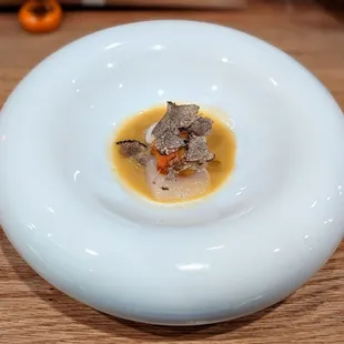 a plate of food on a wooden table