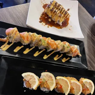 two plates of sushi on a table