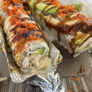two pieces of sushi on a tray