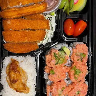 a bento box with a variety of food items