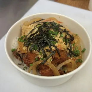CHICKEN KATSU DON    Chicken Katsu simmered in Onions, Carrots, &amp; Eggs cooked in dashi broth over rice!