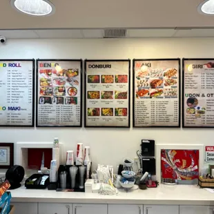 a woman standing in front of a menu