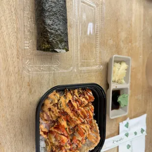 Crunch bowl with a cucumber hand roll