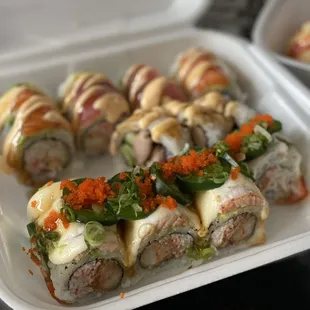 Front: Garlic salmon roll Middle: Dori roll Back: Mono roll