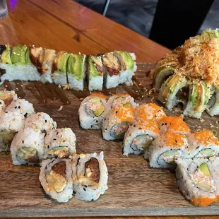 Front left:  spicy tuna roll Front right: California roll Back left: dragon roll Back right: volcano roll
