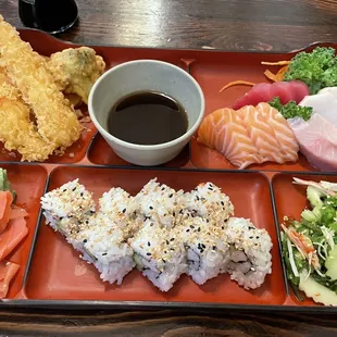 Sashimi bento has fresh selection to melt in your mouth. It comes with tempura, pickled vegetables and sushi...