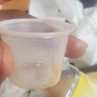 a person holding a plastic cup