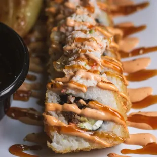 a long roll of sushi on a plate