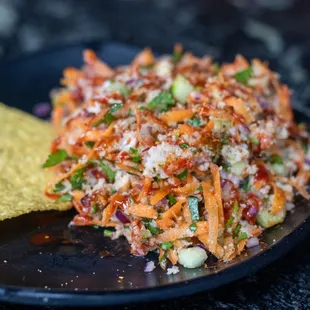 a plate of food with a tortilla