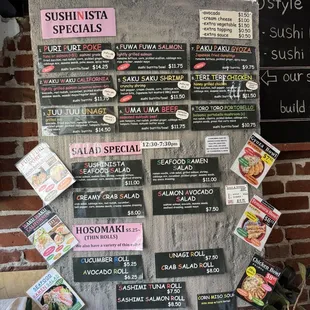 a menu on a brick wall