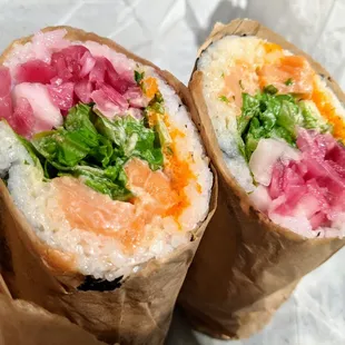 Reel Alaskan sushi burrito. Salmon, house-made &quot;G-sauce,&quot; lettuce, cilantro, masago, pickled red onion, pickled daikon. $12.75.