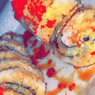 three pieces of sushi on a plate