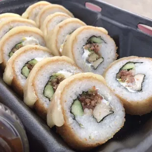 a tray of sushi rolls