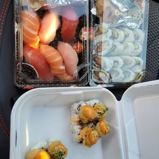 sushi, popcorn shrimp, salmon avocado roll, crab handroll.
