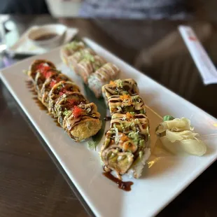 a plate of sushi rolls