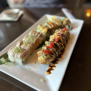 a plate of sushi rolls