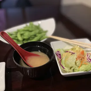 a bowl of soup and a bowl of salad