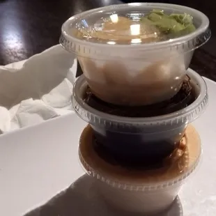 From the top: Ginger and wasabi, eel sauce, spicy shrimp sauce (aka mayo and Sriracha)