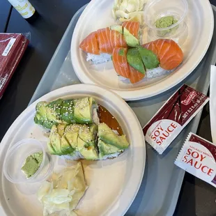 two plates of sushiya on a tray