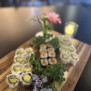 a variety of sushi on a cutting board