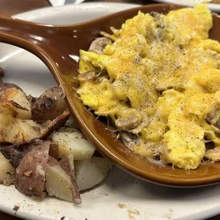 Sunrise scramble w sausage onions and Colby jack cheese