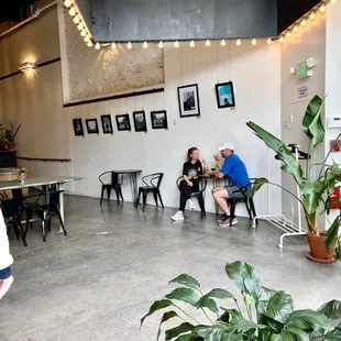 two people sitting at tables