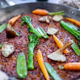 Paella Vegetariana ($46/2 servings) Seasonal Mushrooms, Snow Peas, Carrots, Broccoli, Aioli