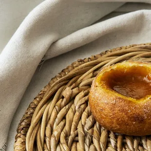 a pastry on a wicker plate