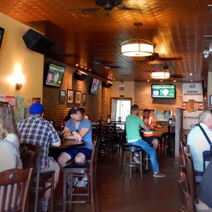 This bar is longer than it is wide, and has plenty of seating.