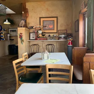 Dining area with antique scales from the original business.