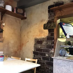 a table and a counter in a restaurant