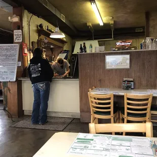 a woman standing at a counter