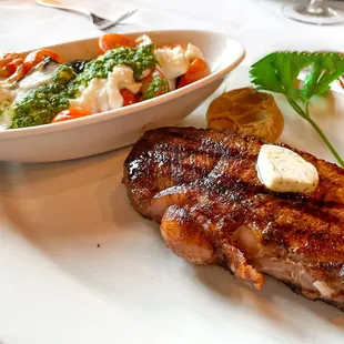 NY Strip with zucchini and tomatoes, burrata dish.