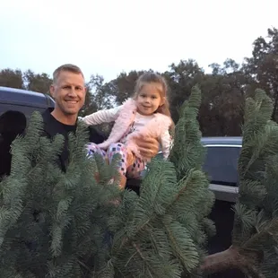 They unloaded a truck load of trees and literally held up tree after until we found the "one" well two!  they were so nice!