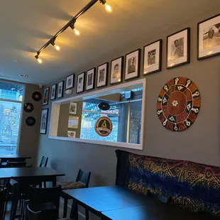 a wall of framed art