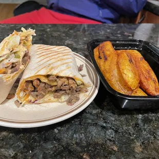 a burrito and french fries