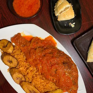 a plate of food with meat and rice