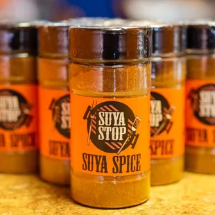 three jars of spice on a table