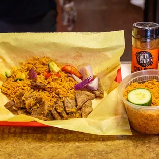 a plate of food with rice and vegetables