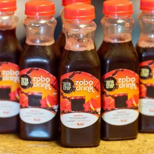 six bottles of sauce on a counter