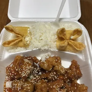 chicken and rice in a styrofoam container