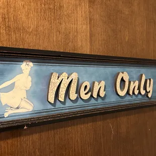 In the ladies room on the back of the door