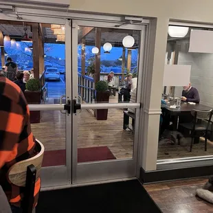 a view of a restaurant from the front door